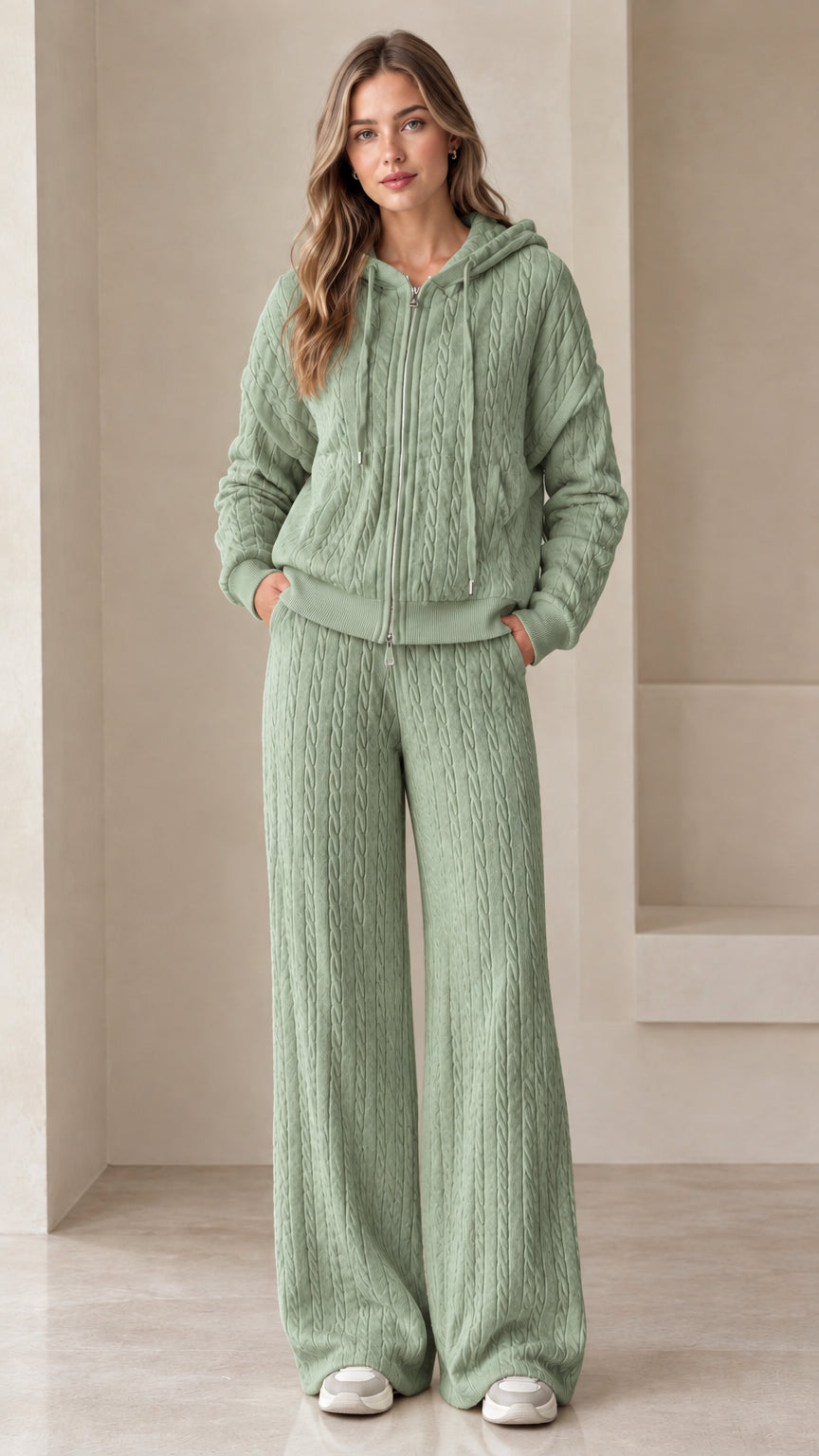 Full-length view of woman wearing sage green cable knit hoodie and wide leg lounge set