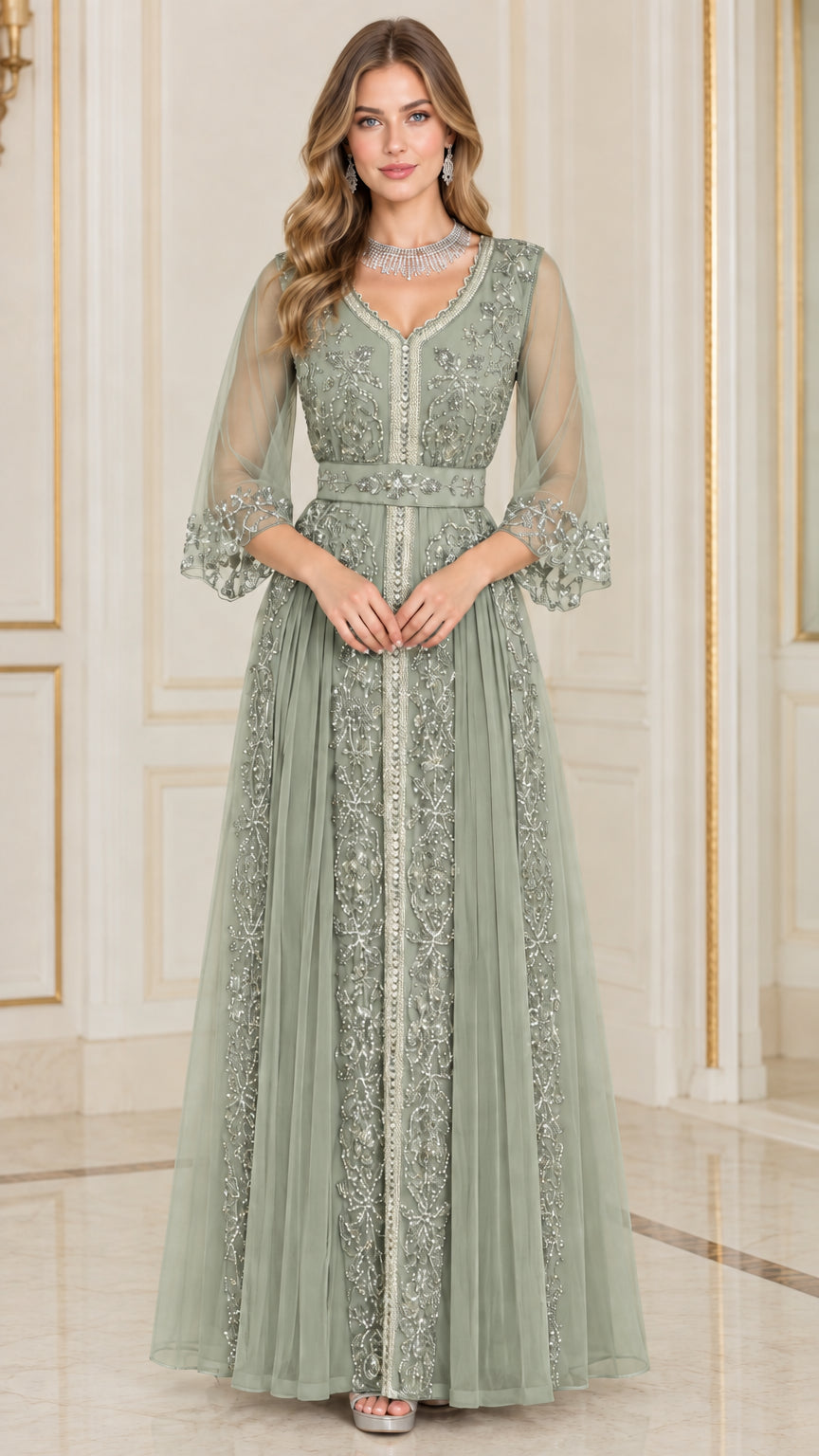 Front full-length view of woman in sage green beaded embroidered evening gown