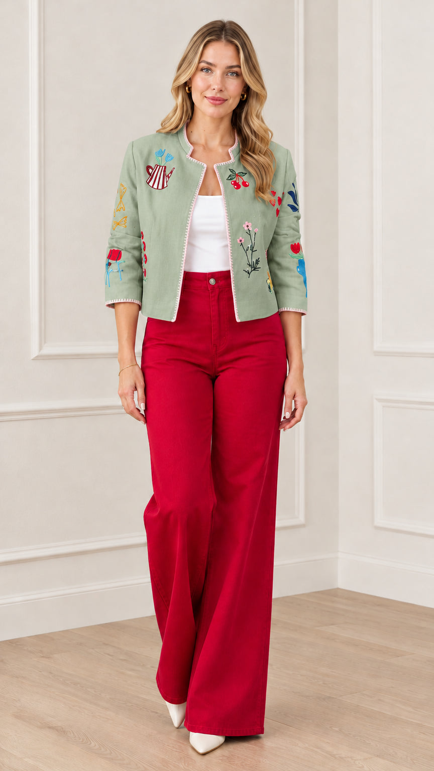 Sage green embroidered open front cropped jacket styled with red trousers