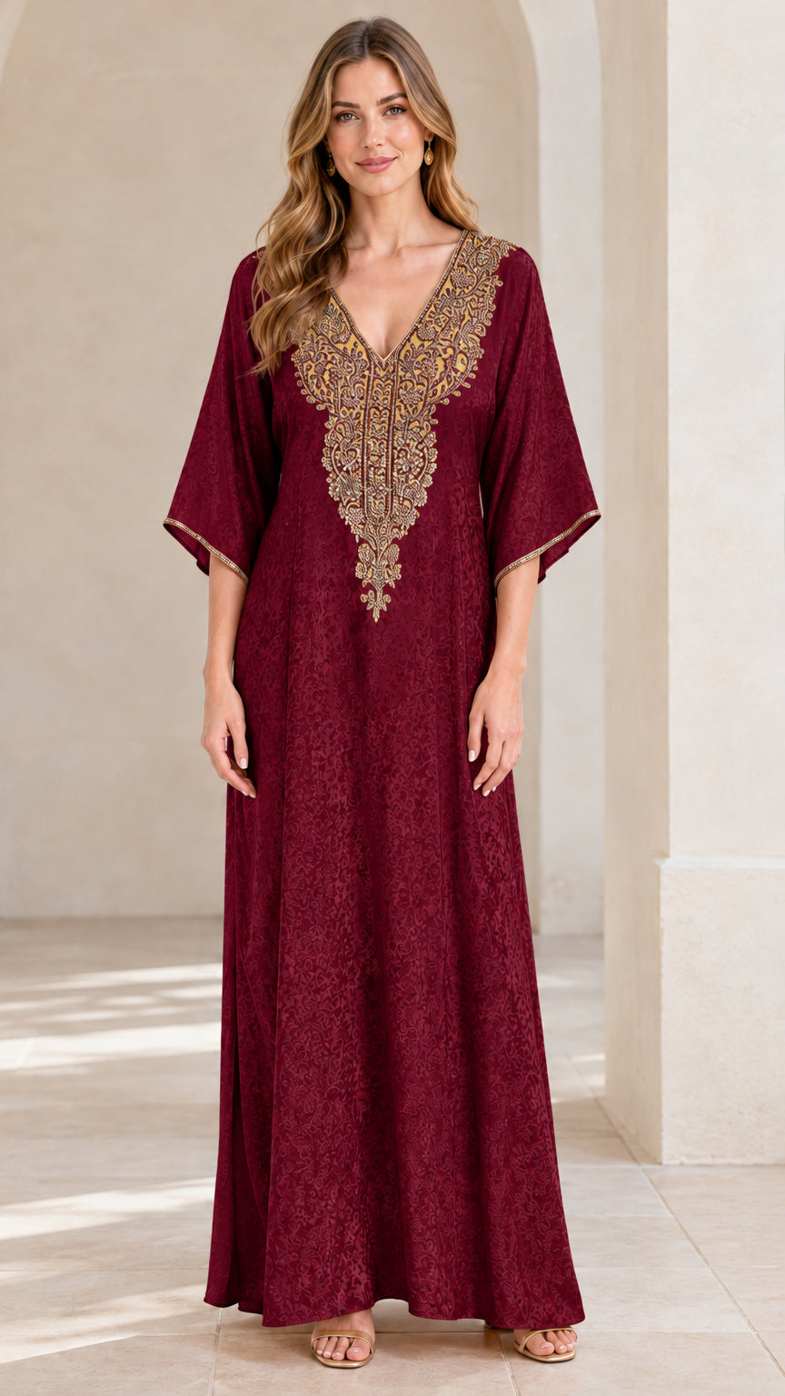Full front view of woman wearing burgundy wine red embroidered kaftan maxi dress