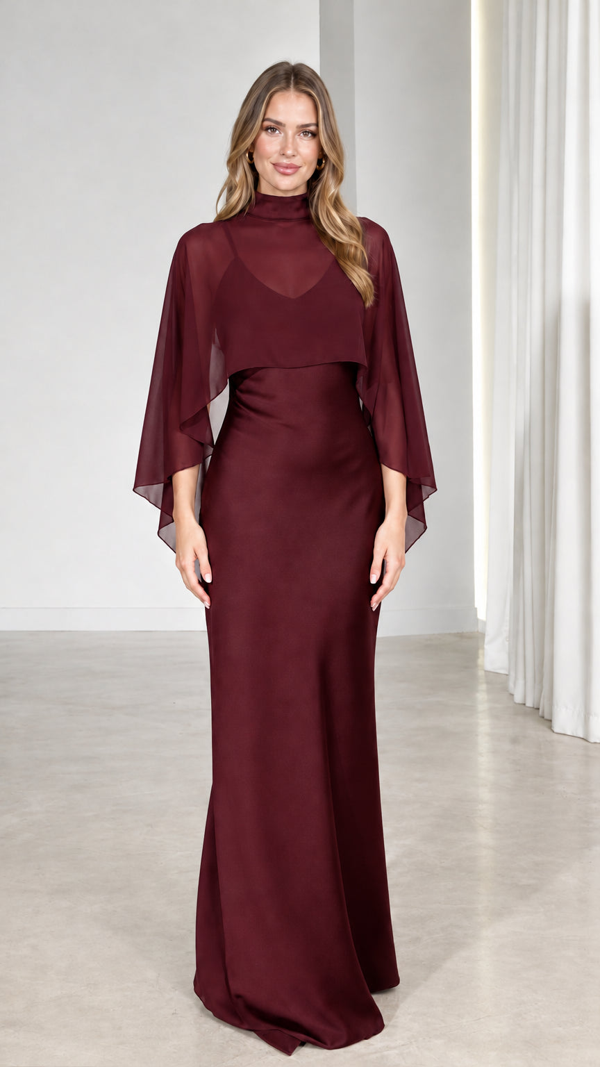 Front view of model wearing Burgundy wine sheer capelet floor-length gown