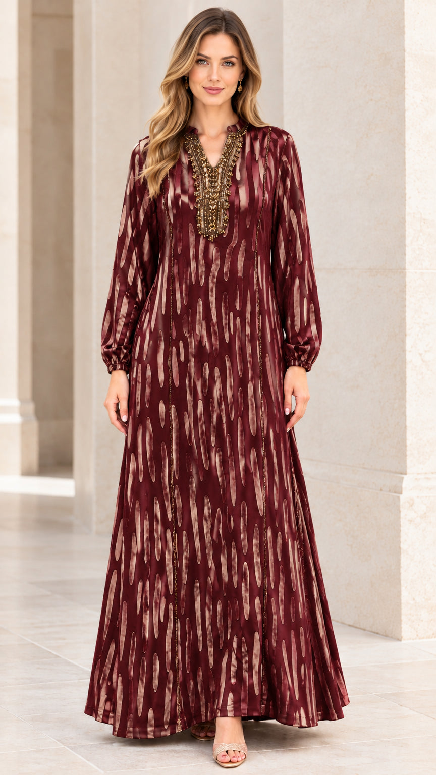 Front view of woman wearing Burgundy beaded long sleeve maxi dress