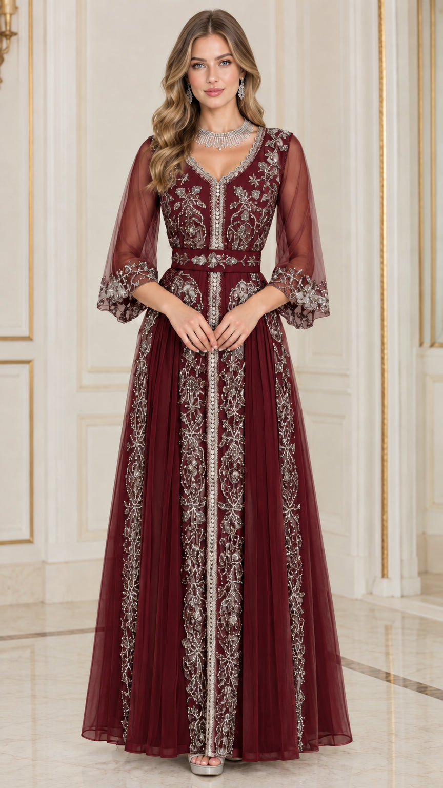 Front full-length view of woman in burgundy red embroidered beaded evening dress