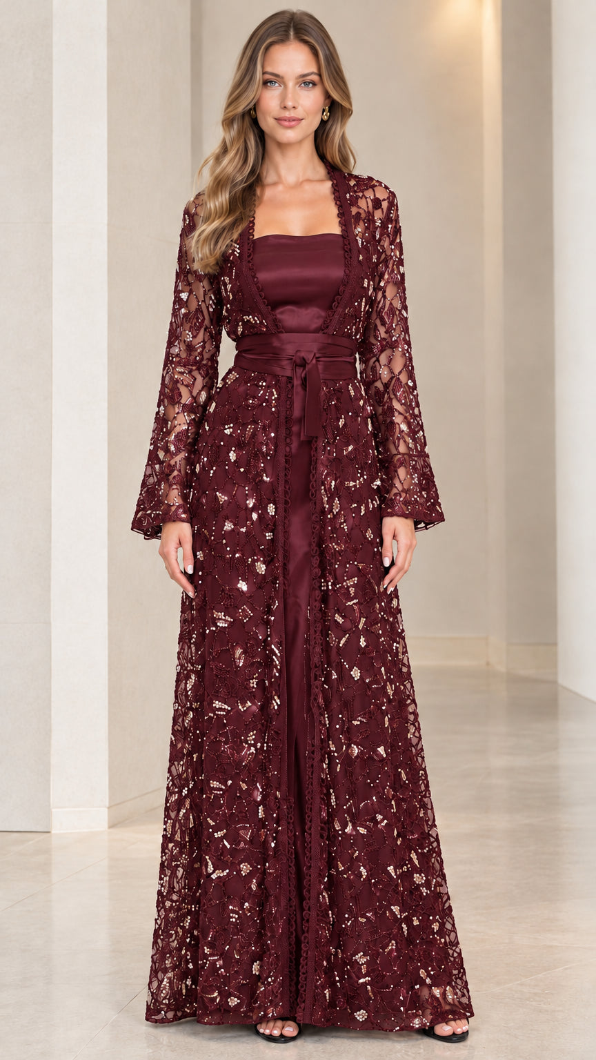 Model wearing deep burgundy wine sequined evening jacket and coordinated satin gown