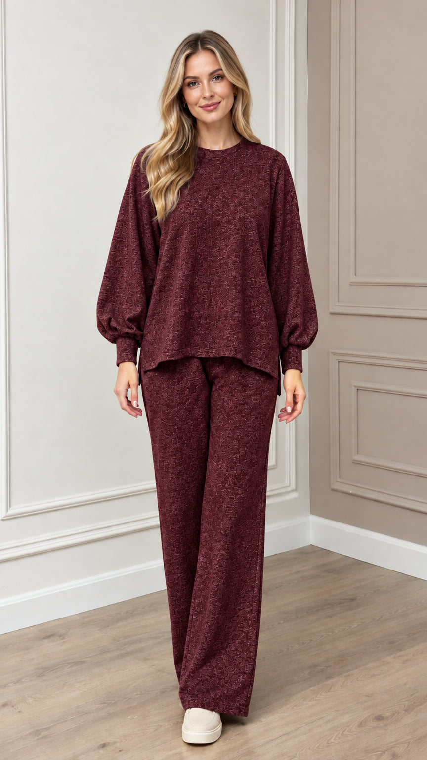 Model wearing burgundy textured knit two-piece lounge set