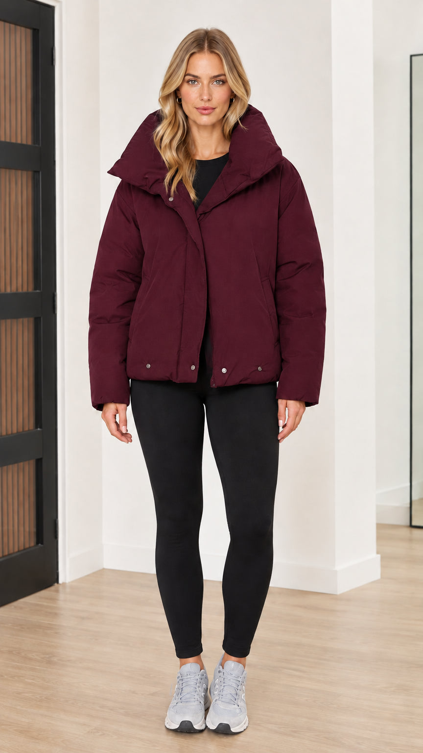 Front view of woman wearing burgundy wine red funnel collar puffer jacket