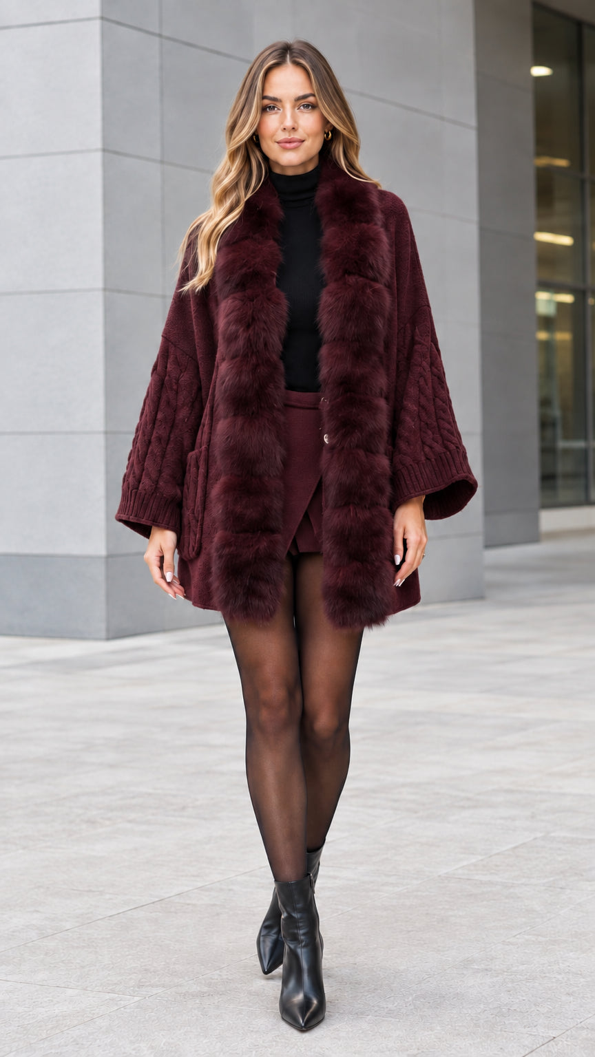 Full-length view of woman wearing burgundy faux fur trim cable knit cardigan coat