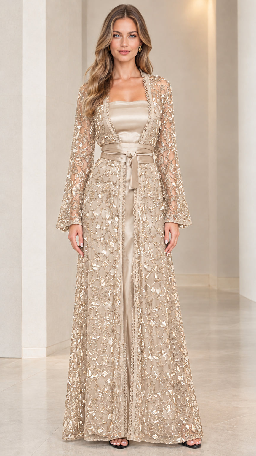 Model wearing champagne gold sequin lace duster coat and floor-length satin dress