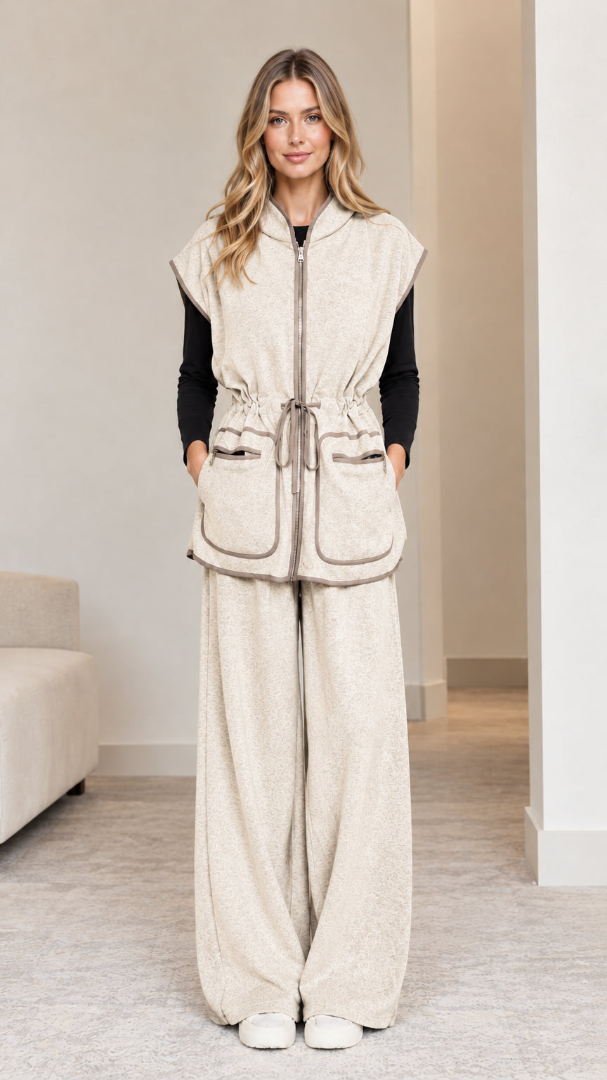 Model wearing oatmeal beige 2-piece hooded vest and wide-leg pants set