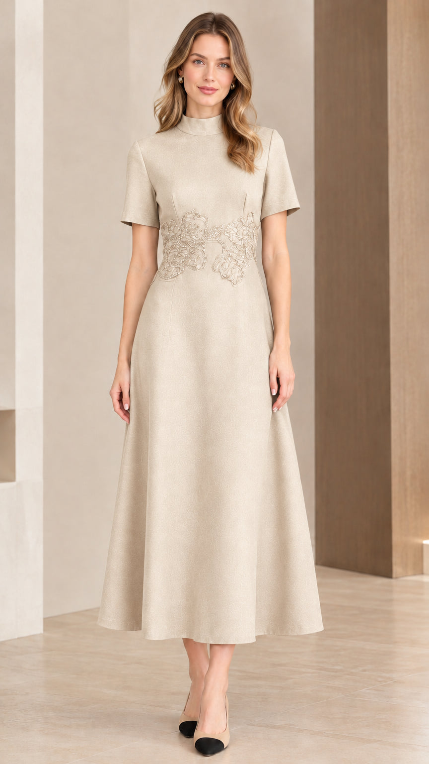 Woman wearing champagne beige mock neck A-line midi evening dress